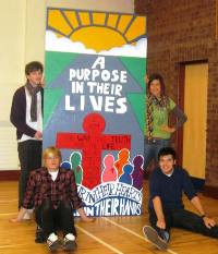 Ashton, Jonathan, Clare and Karl with the mural they made for Holy Trinity Parish, Woodburn.